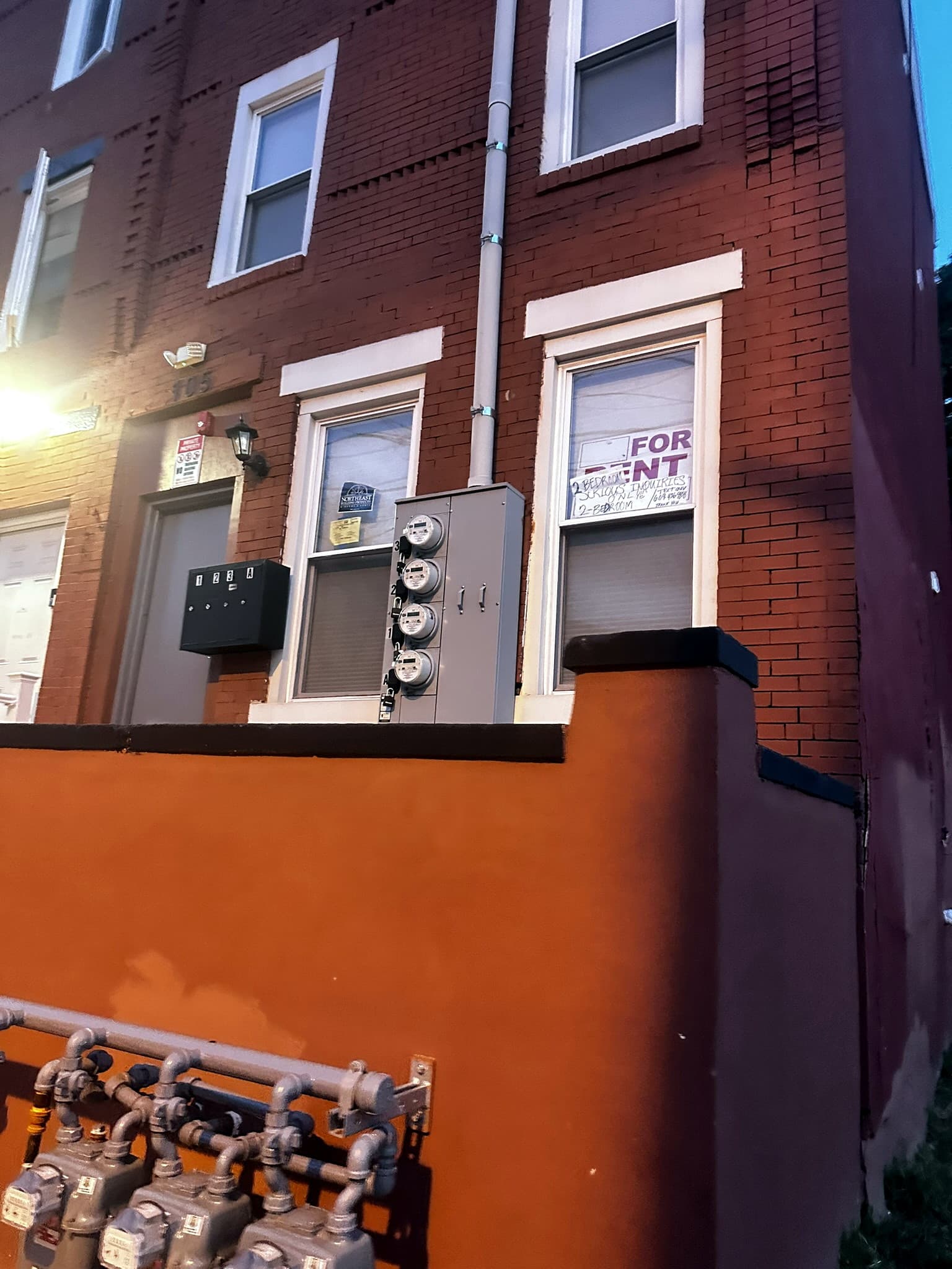 Front of the brick residence photographed while moving along the facade, frame 1 of 8
